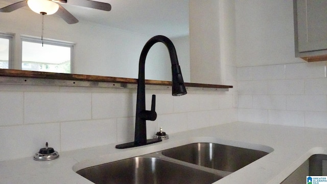 1501 Graymont Ave W, Birmingham, AL 35208 - interior details with a sink, ceiling fan, decorative backsplash, and light countertops