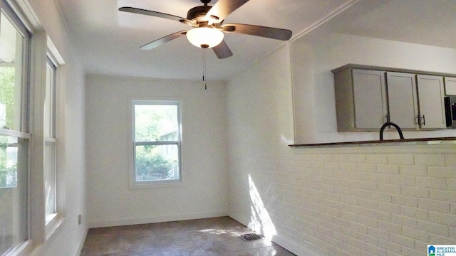 1501 Graymont Ave W, Birmingham, AL 35208 - unfurnished room featuring ceiling fan and baseboards