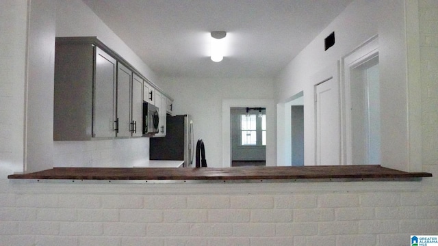 1501 Graymont Ave W, Birmingham, AL 35208 - kitchen with gray cabinets, stainless steel appliances, and a sink