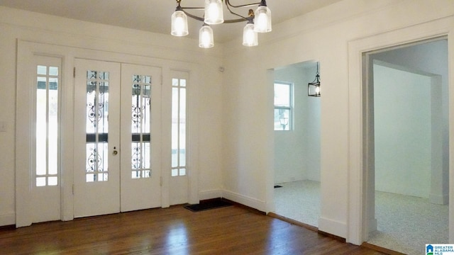 1501 Graymont Ave W, Birmingham, AL 35208 - entryway featuring baseboards, wood finished floors, an inviting chandelier, and french doors