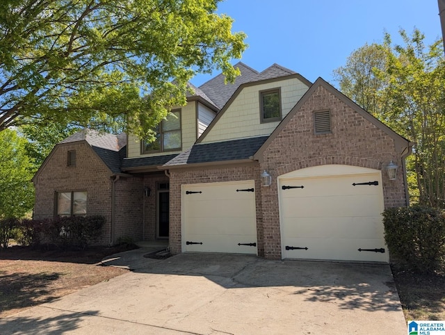 4206 Shinnecock Cir, Bessemer, AL 35022 - view of front facade with concrete driveway, brick siding, a garage, and a shingled roof