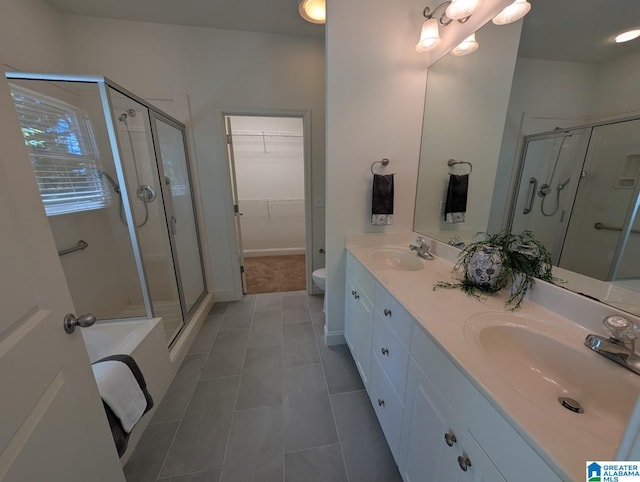 4206 Shinnecock Cir, Bessemer, AL 35022 - full bath with a stall shower, double vanity, a sink, and a spacious closet