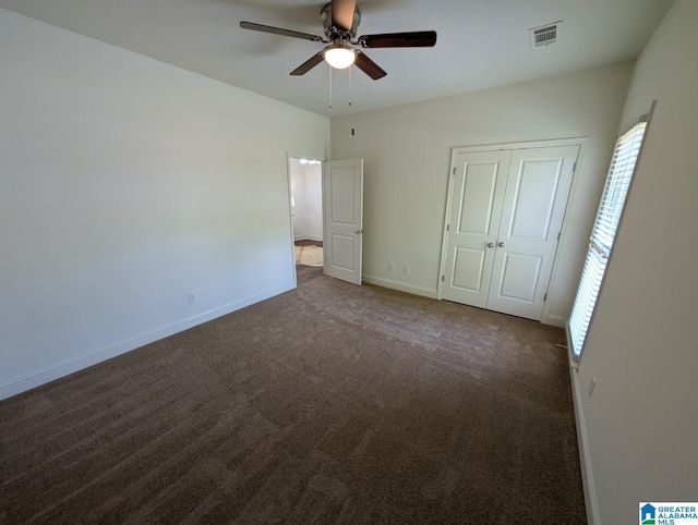 4206 Shinnecock Cir, Bessemer, AL 35022 - unfurnished bedroom featuring a closet, baseboards, carpet flooring, a ceiling fan, and visible vents
