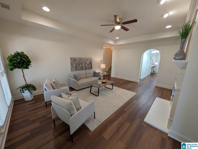 4206 Shinnecock Cir, Bessemer, AL 35022 - living room featuring ceiling fan, a tray ceiling, arched walkways, visible vents, and recessed lighting