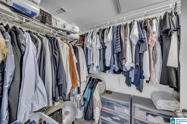 spacious closet featuring visible vents and attic access