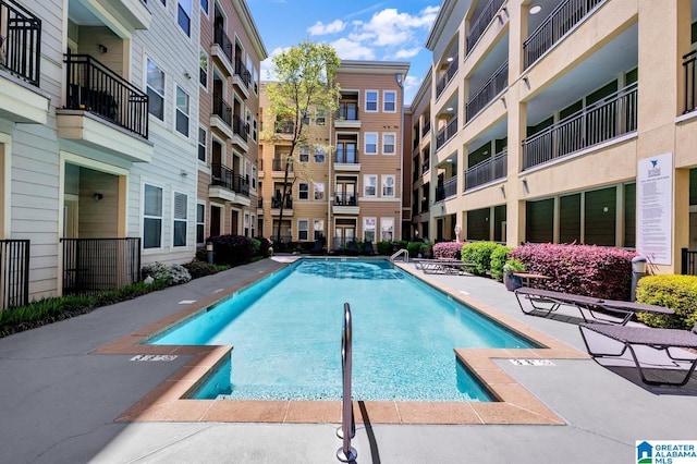 view of swimming pool with a patio area