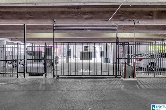 view of gate with fence