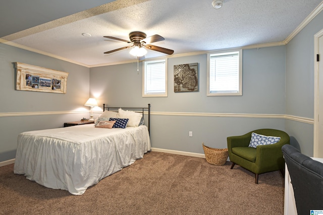 carpeted bedroom with ceiling fan, a textured ceiling, baseboards, and ornamental molding