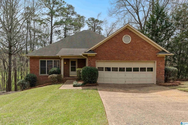 view of front facade with an attached garage, driveway, a front lawn, and brick siding
