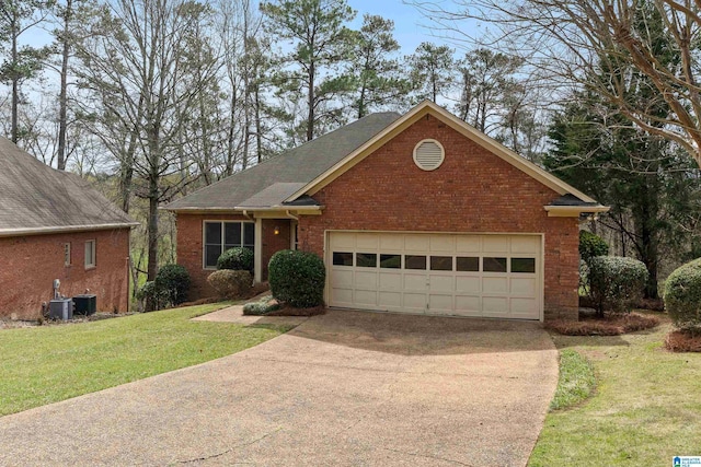 view of front facade with a front yard, brick siding, driveway, and an attached garage