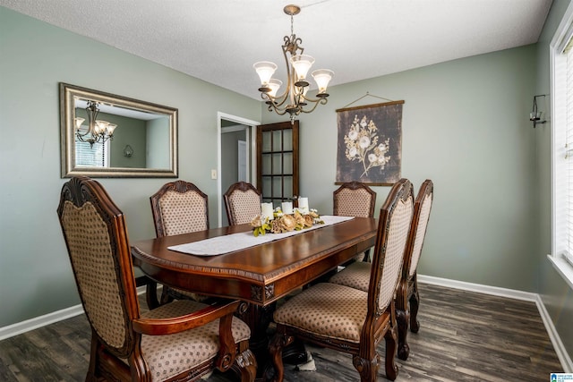 13563 Date St, Northport, AL 35475 - dining room with wood finished floors, a chandelier, plenty of natural light, and baseboards