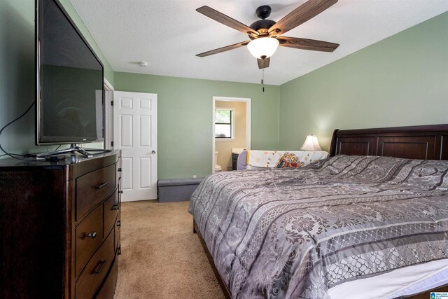 13563 Date St, Northport, AL 35475 - bedroom with ceiling fan, light colored carpet, and ensuite bathroom
