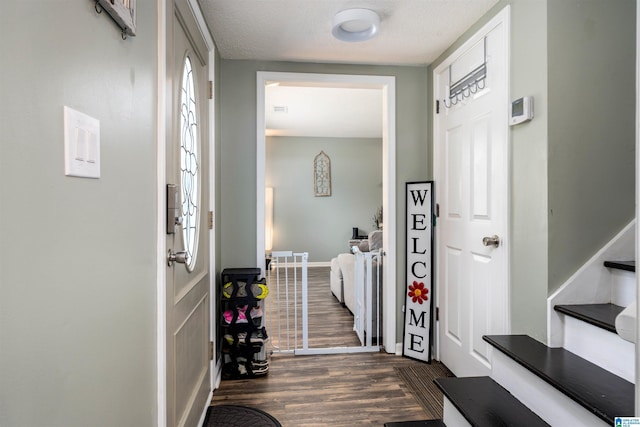 13563 Date St, Northport, AL 35475 - entryway featuring dark wood-style floors, stairway, and baseboards