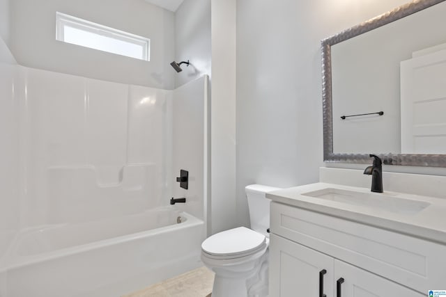 full bath with toilet, vanity, and shower / washtub combination