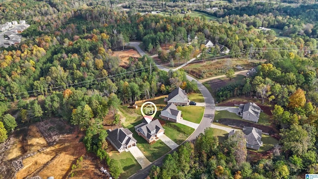 drone / aerial view featuring a view of trees