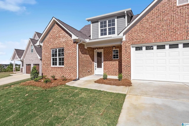 traditional-style house featuring brick siding, a front lawn, a garage, and concrete driveway