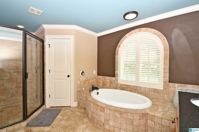 bathroom with visible vents, a shower stall, crown molding, a garden tub, and vanity