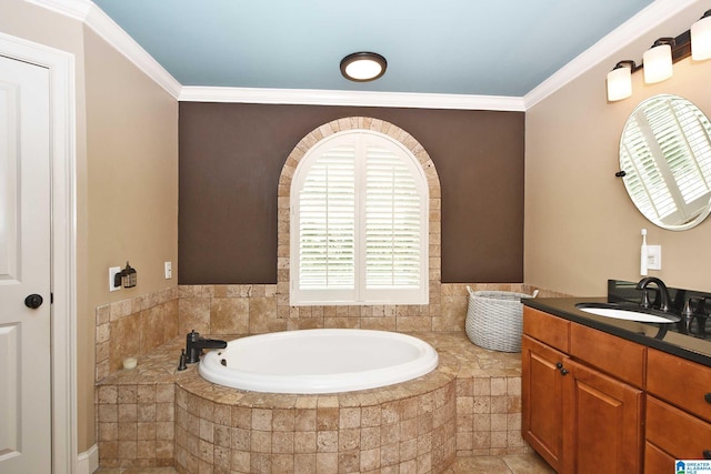bathroom featuring a bath, ornamental molding, and vanity