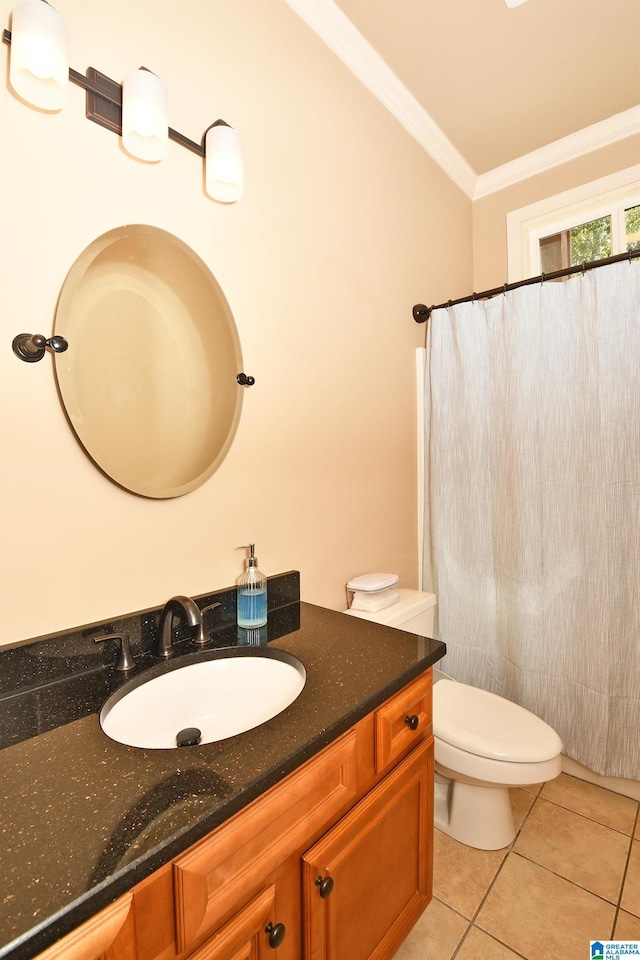bathroom with tile patterned flooring, toilet, ornamental molding, and vanity