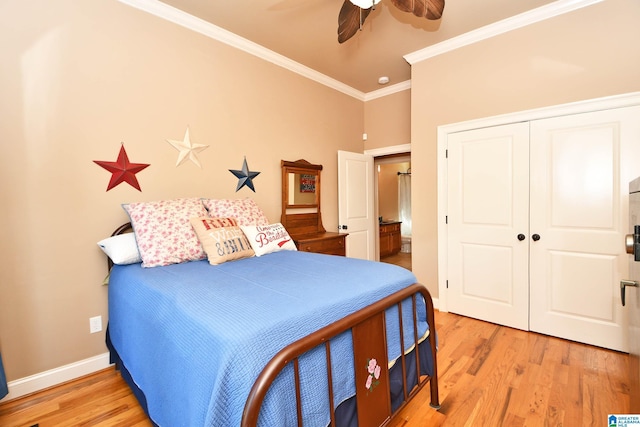bedroom featuring a closet, crown molding, baseboards, light wood-style flooring, and ceiling fan