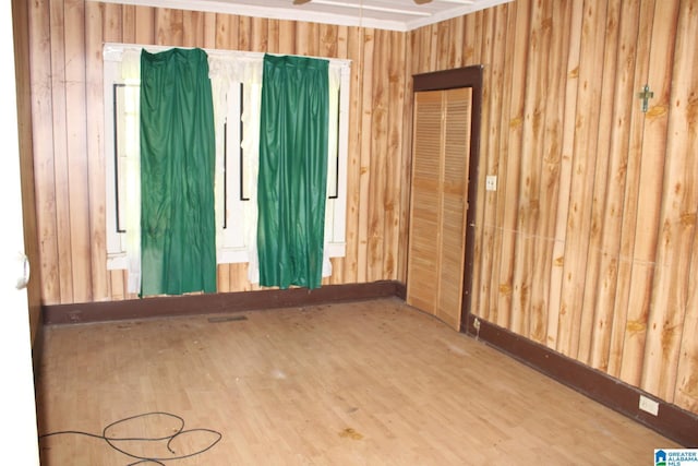 440 12th St W, Birmingham, AL 35208 - spare room with wood finished floors, wooden walls, and a ceiling fan