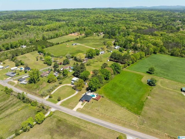 birds eye view of property with a rural view and a forest view