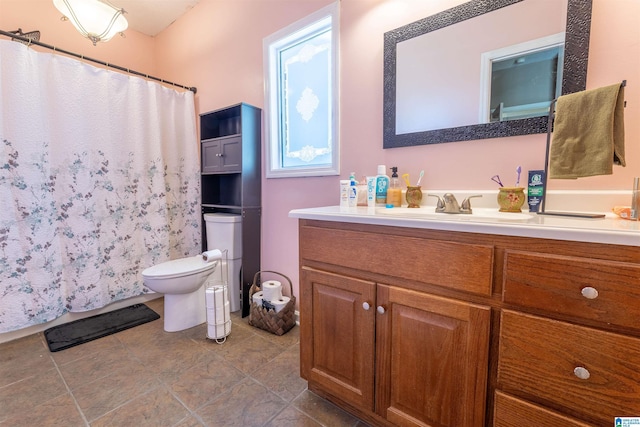 bathroom with a shower with shower curtain, toilet, and vanity