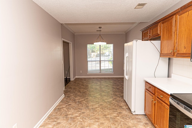 kitchen with brown cabinetry, visible vents, hanging light fixtures, light countertops, and ornamental molding