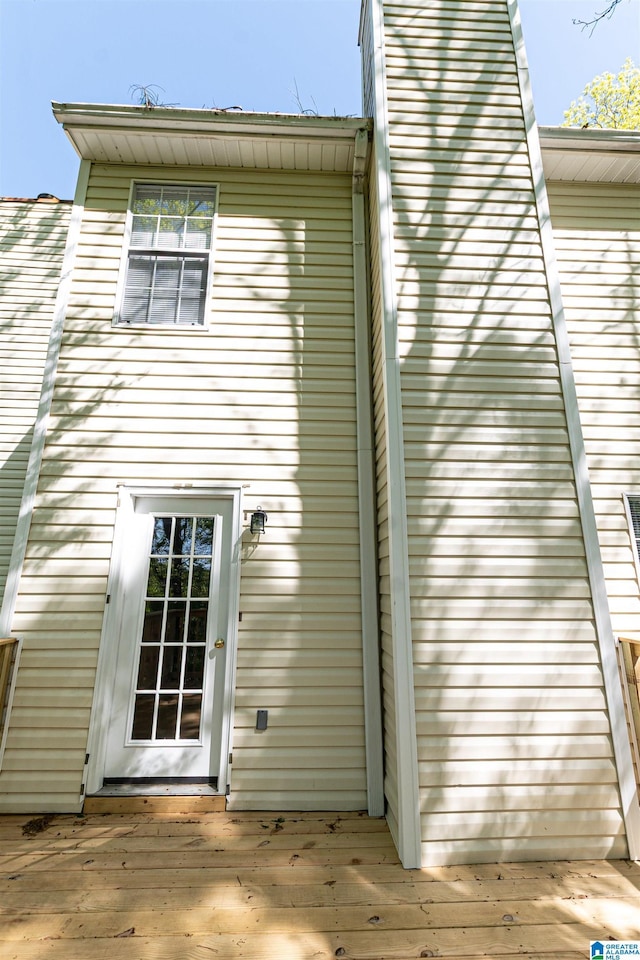 rear view of property featuring a deck