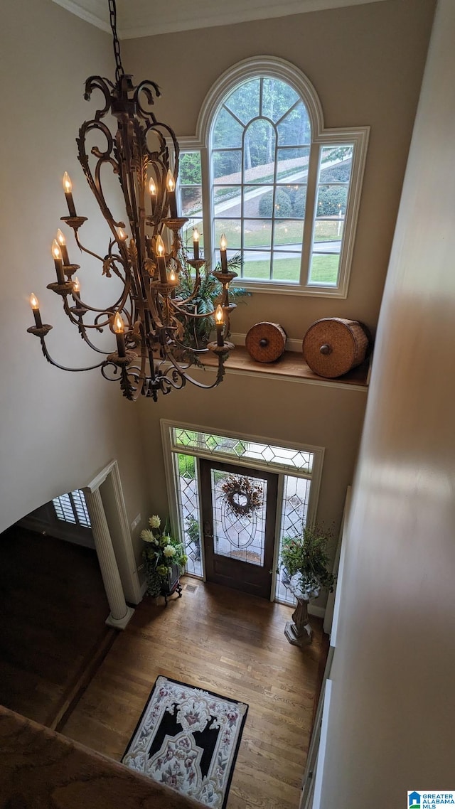 1065 Saint Andrews Pkwy, Oneonta, AL 35121 - entryway featuring plenty of natural light, wood finished floors, and an inviting chandelier