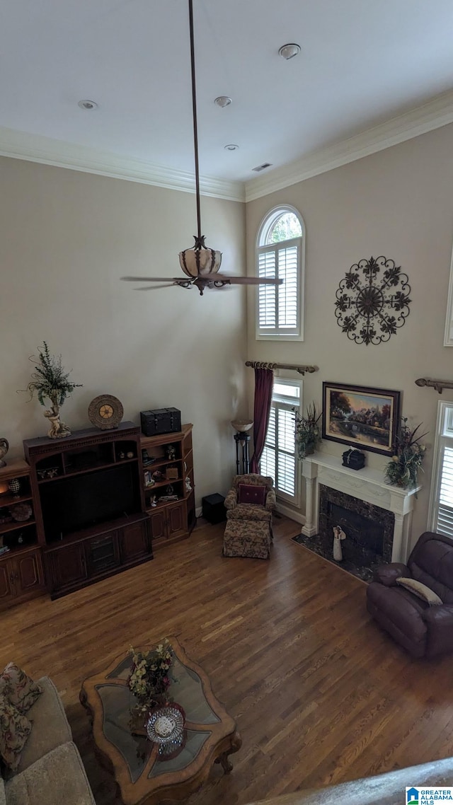 1065 Saint Andrews Pkwy, Oneonta, AL 35121 - living room with a high end fireplace, wood finished floors, and crown molding