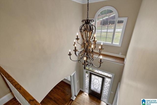 1065 Saint Andrews Pkwy, Oneonta, AL 35121 - entrance foyer featuring baseboards, wood finished floors, an inviting chandelier, and crown molding