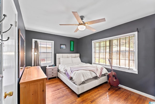 2110 S 4th Ave, Irondale, AL 35210 - bedroom with light wood-style floors, baseboards, and a ceiling fan