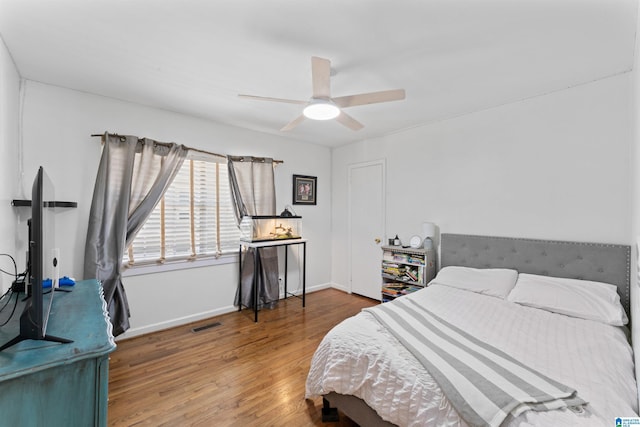 2110 S 4th Ave, Irondale, AL 35210 - bedroom featuring visible vents, baseboards, a ceiling fan, and wood finished floors