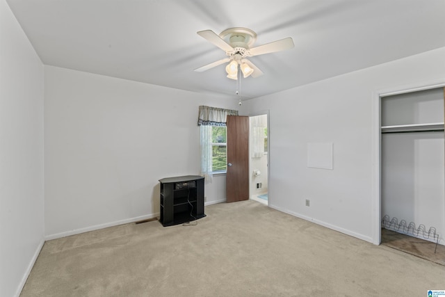 unfurnished bedroom with a closet, ceiling fan, baseboards, and carpet floors