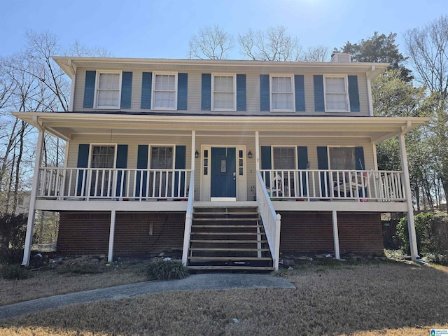 913 Falling Star Ln, Alabaster, AL 35007 - colonial-style house featuring a porch, a chimney, and stairs