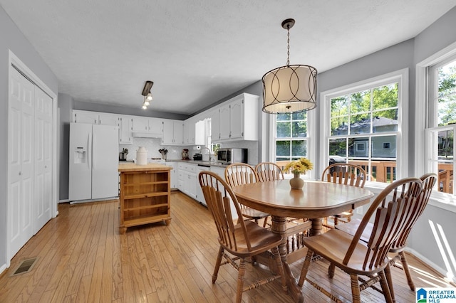 913 Falling Star Ln, Alabaster, AL 35007 - dining room featuring light wood-style flooring and visible vents