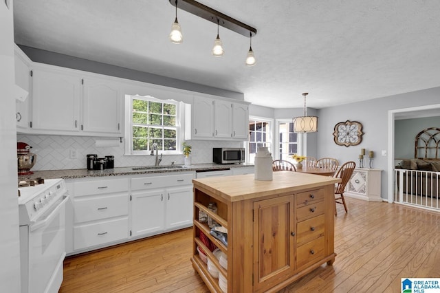 913 Falling Star Ln, Alabaster, AL 35007 - kitchen featuring backsplash, white appliances, a sink, and wooden counters