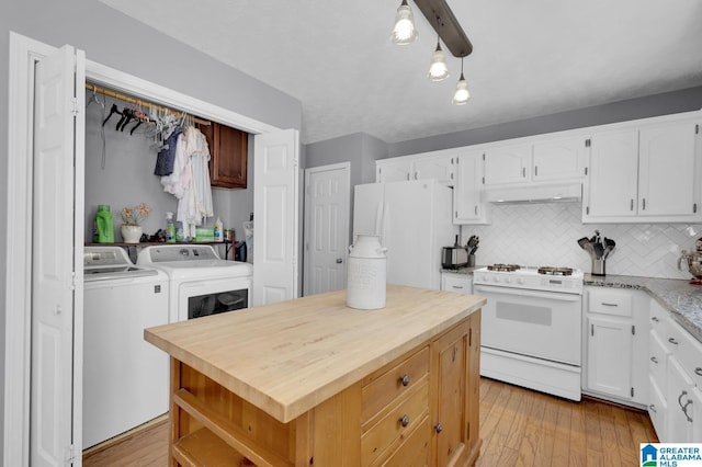 913 Falling Star Ln, Alabaster, AL 35007 - kitchen with white cabinets, washer and clothes dryer, backsplash, white appliances, and under cabinet range hood