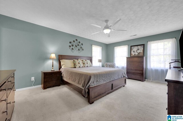 913 Falling Star Ln, Alabaster, AL 35007 - bedroom with light colored carpet, ceiling fan, baseboards, and a textured ceiling