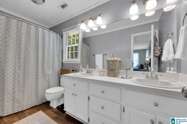 913 Falling Star Ln, Alabaster, AL 35007 - bathroom featuring visible vents, wood finished floors, a sink, and double vanity