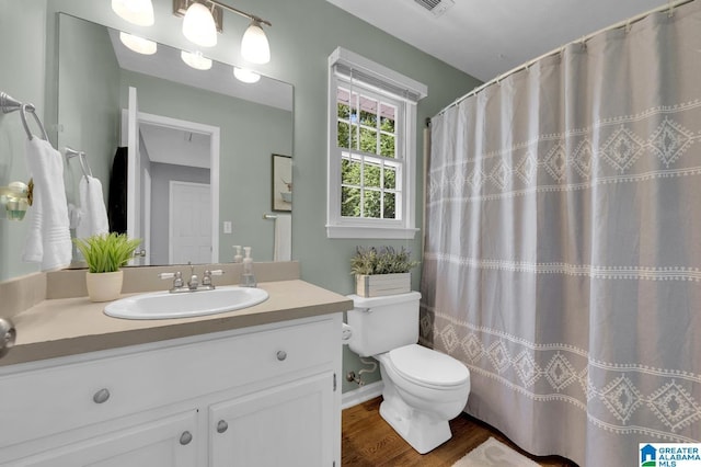 913 Falling Star Ln, Alabaster, AL 35007 - full bathroom featuring wood finished floors, vanity, and toilet