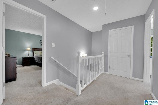 913 Falling Star Ln, Alabaster, AL 35007 - hall with baseboards, carpet flooring, an upstairs landing, and recessed lighting