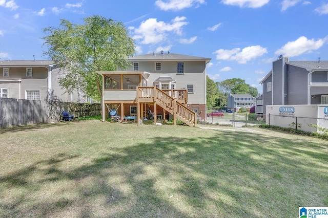 913 Falling Star Ln, Alabaster, AL 35007 - rear view of property featuring a lawn, a fenced backyard, a sunroom, and stairs