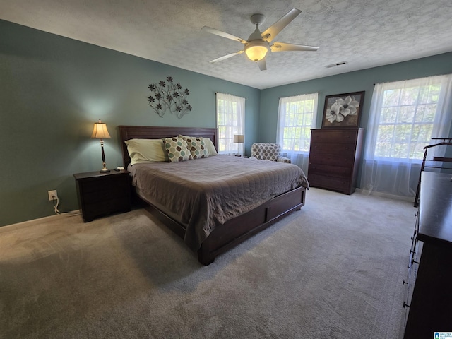 913 Falling Star Ln, Alabaster, AL 35007 - bedroom featuring visible vents, a ceiling fan, carpet, and a textured ceiling