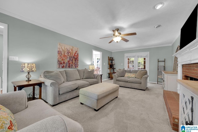 913 Falling Star Ln, Alabaster, AL 35007 - living area featuring a ceiling fan, crown molding, light carpet, baseboards, and a brick fireplace