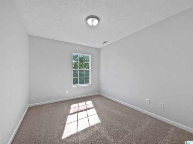 3 Holt Ave, Birmingham, AL 35214 - carpeted spare room featuring a textured ceiling, baseboards, and visible vents