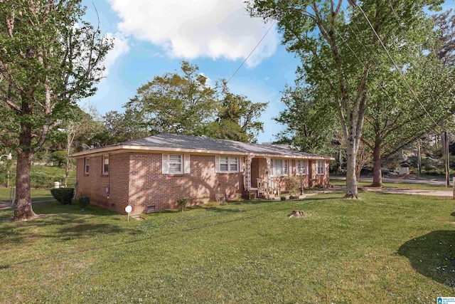 ranch-style home with crawl space, a front lawn, and brick siding