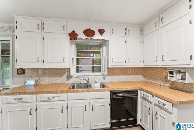 kitchen featuring dishwasher, white cabinetry, plenty of natural light, and a sink