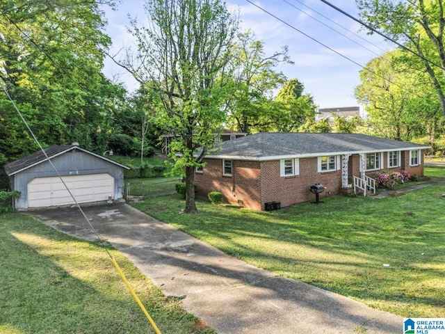 view of home's exterior featuring an outbuilding, brick siding, a yard, and a garage